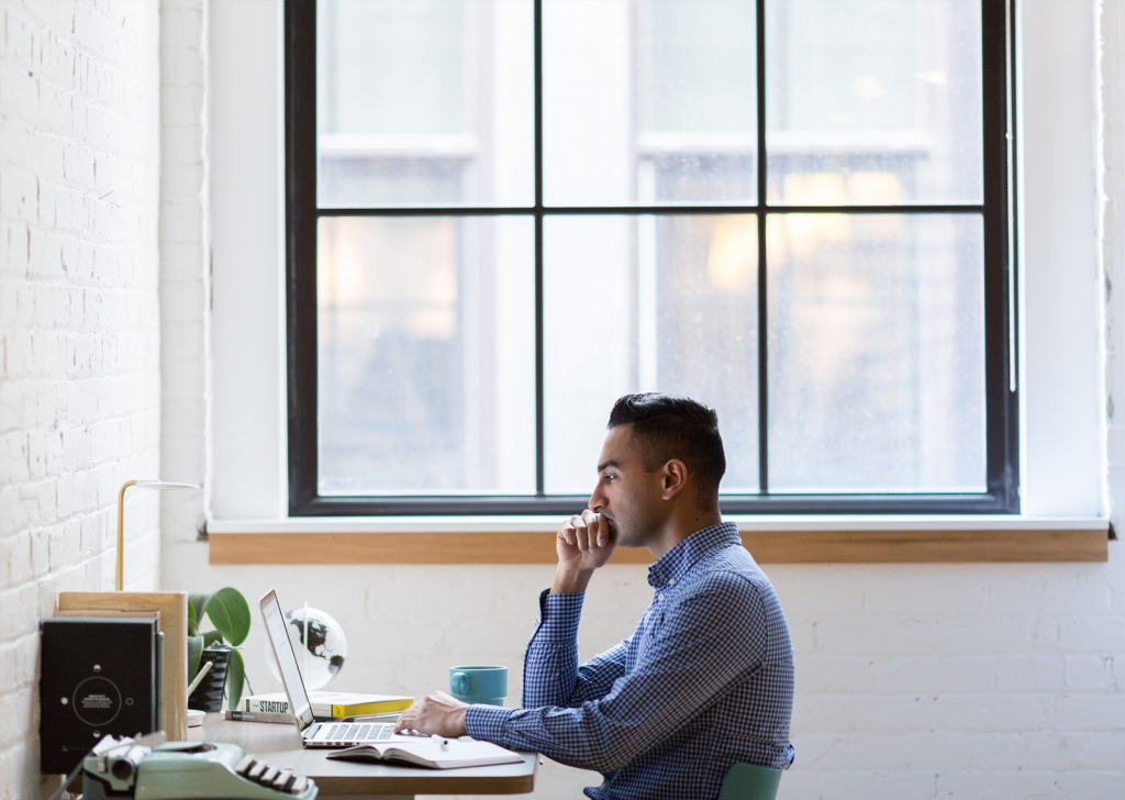 Contemplative Man on Computer